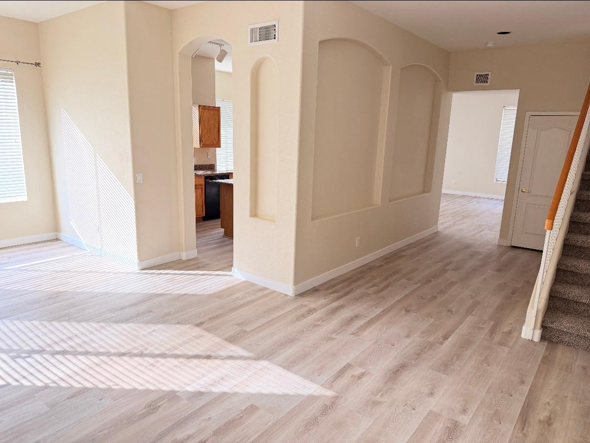 17640 North 17th Street Phoenix, AZ 85022 - Photo 3 of 21 a view of a hallway view with wooden floor and staircase