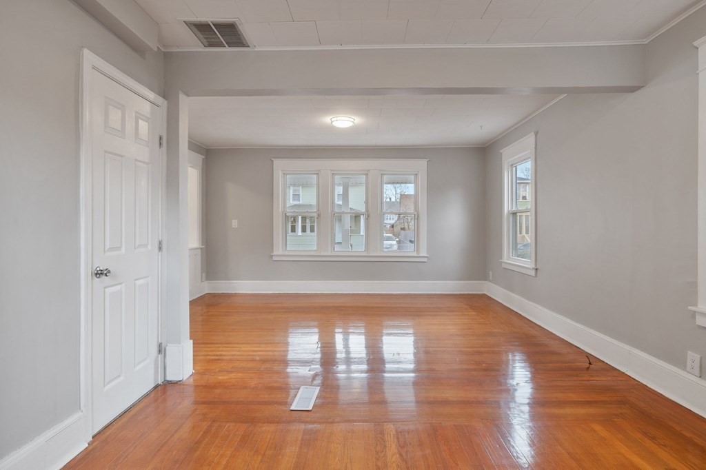 126 Stockman Street Springfield, MA 01104 - Photo 7 of 25 a view of empty room with wooden floor and fan