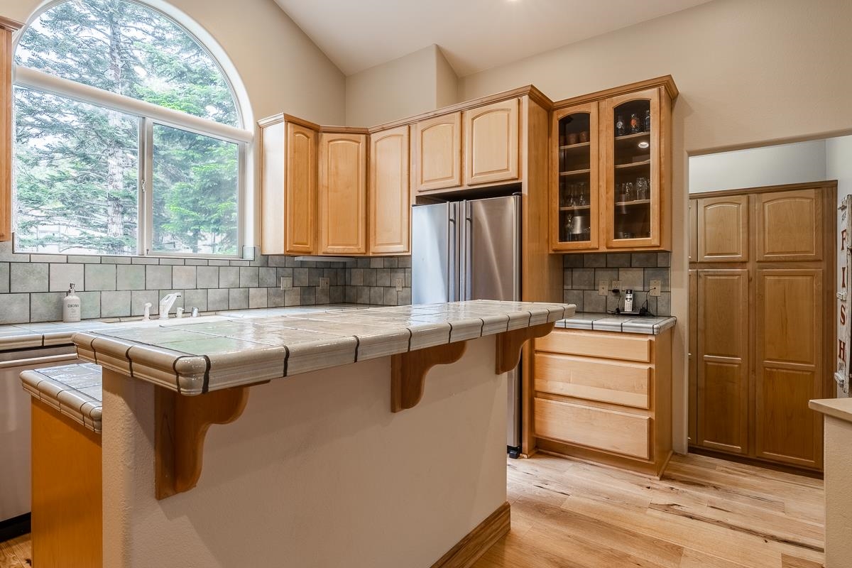 33 Kelley Road Mammoth Lakes, CA 93546 - Photo 17 of 49 a kitchen with a refrigerator and a sink