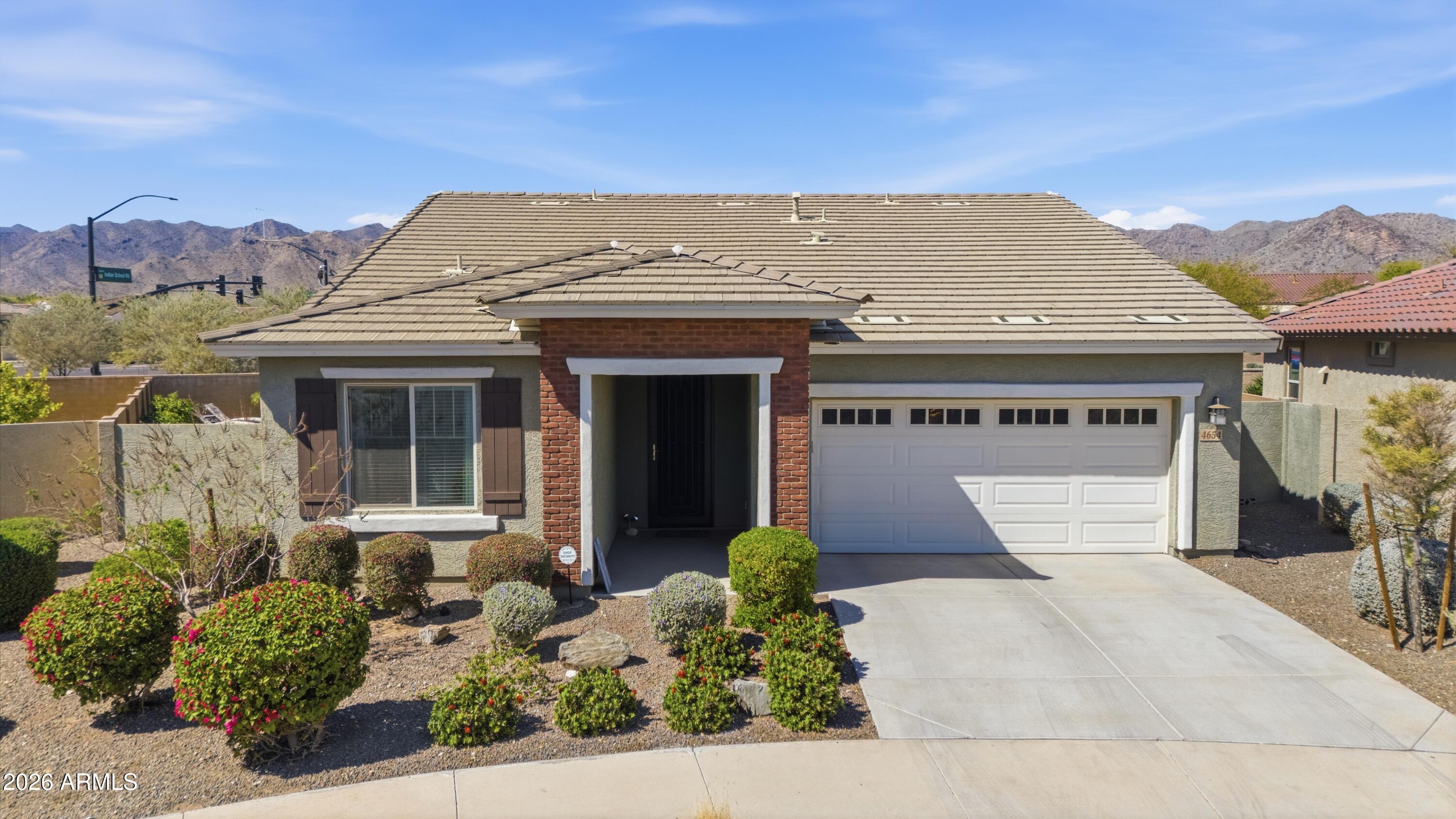 4654 North 204th Lane Buckeye, AZ 85396 - Photo 1 of 41 front view of a house with a yard