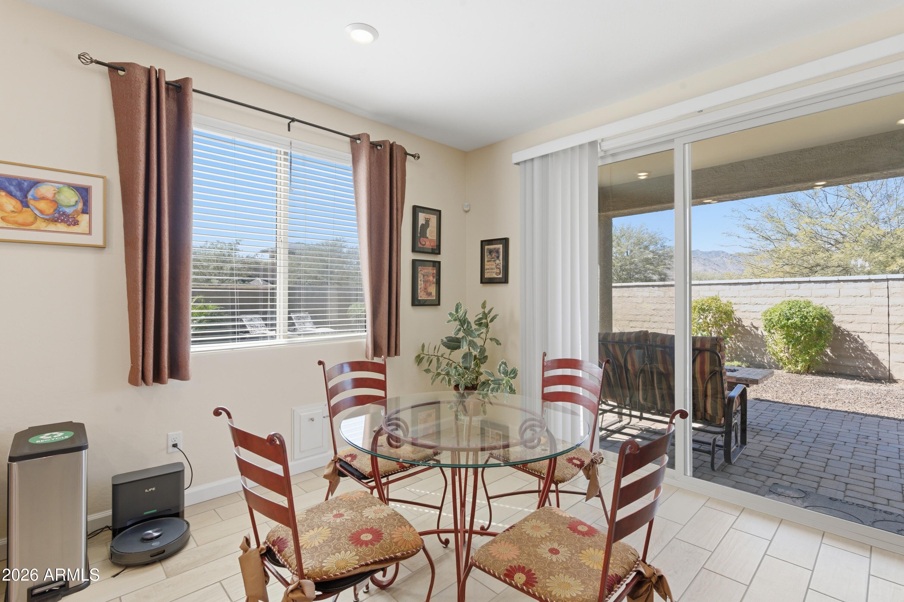 4654 North 204th Lane Buckeye, AZ 85396 - Photo 20 of 41 a dining room with furniture and window