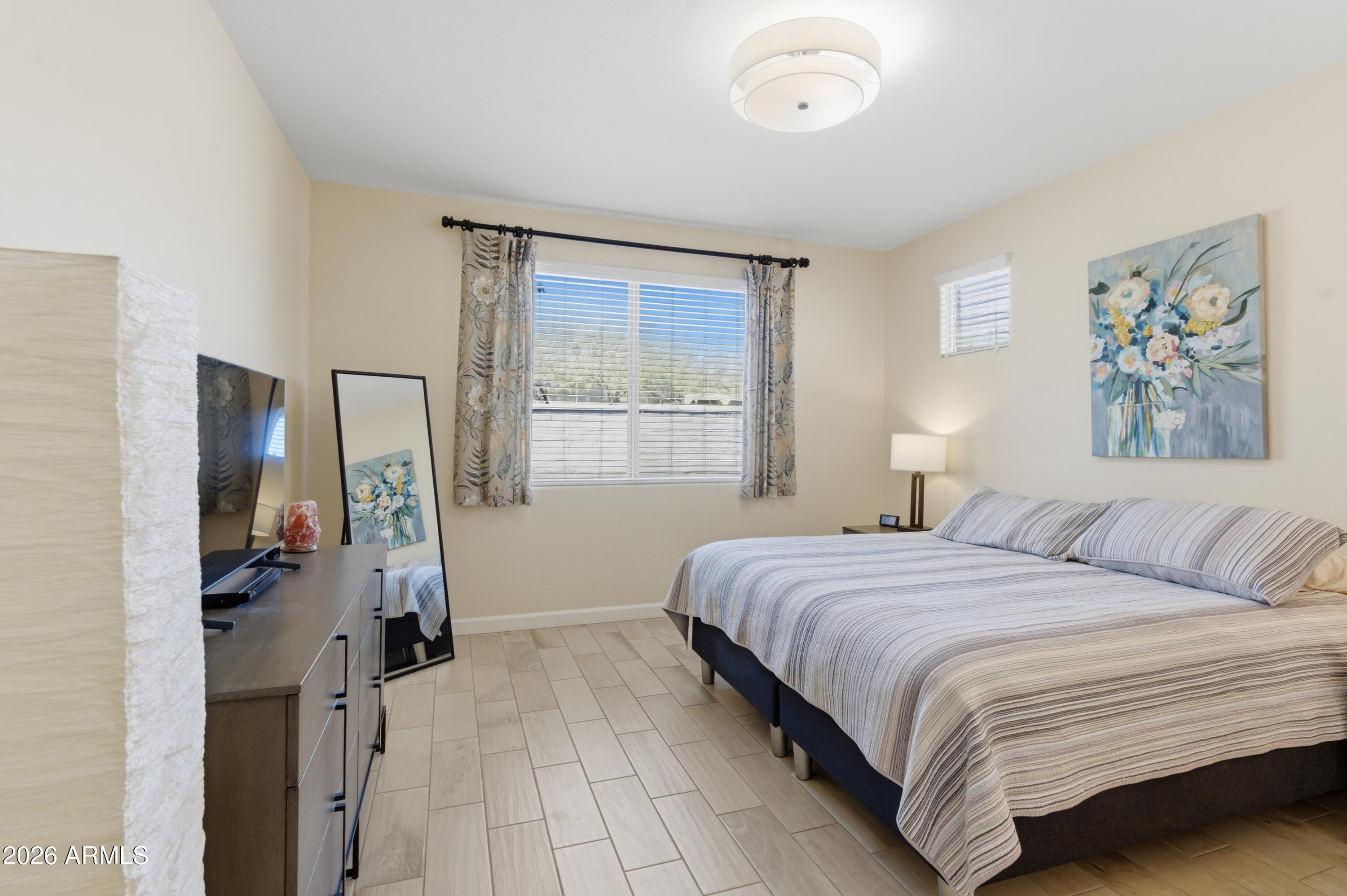 4654 North 204th Lane Buckeye, AZ 85396 - Photo 24 of 41 a bedroom with a bed and a window