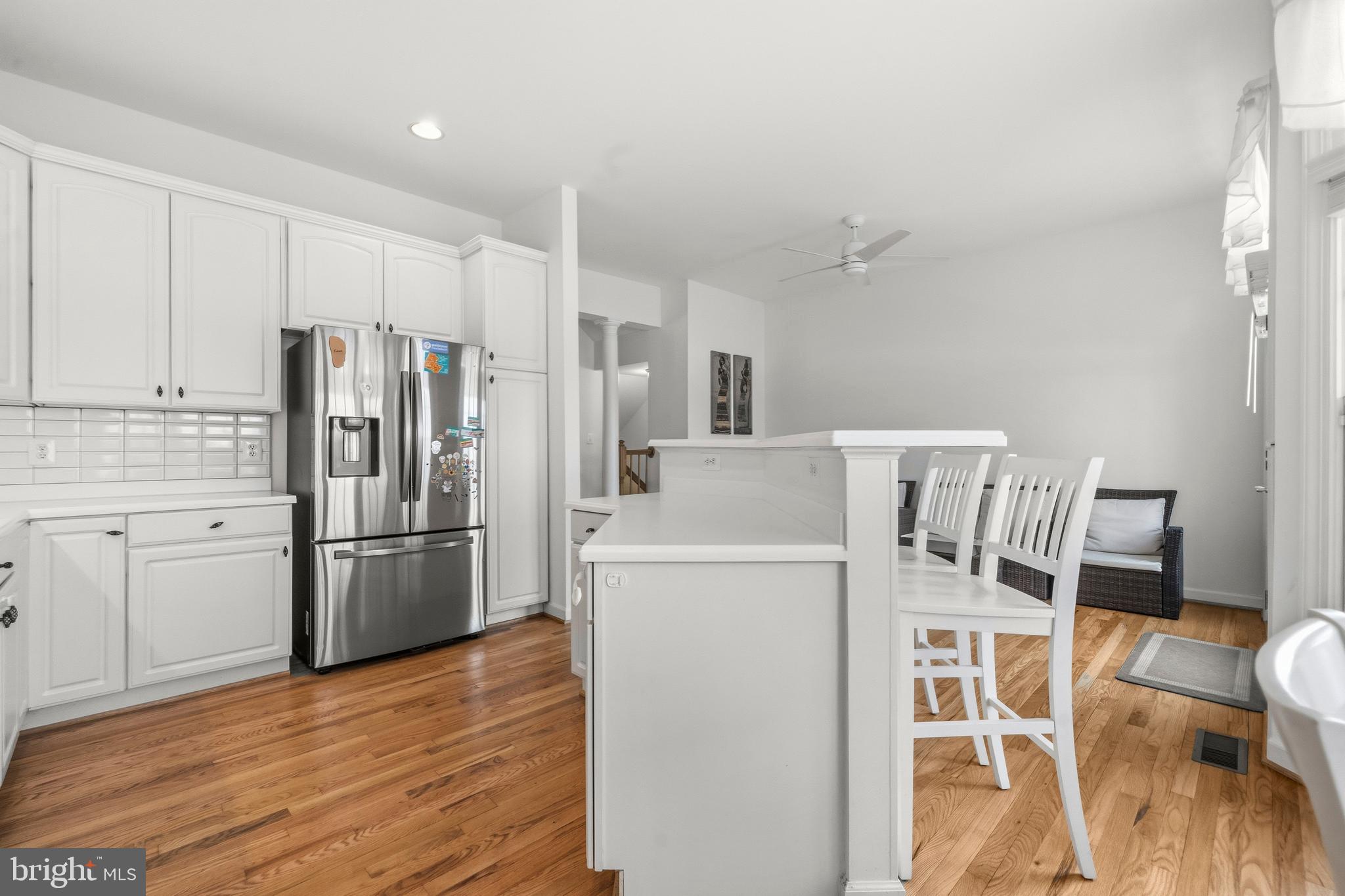43003 Golf View Drive Chantilly, VA 20152 - Photo 13 of 54 a kitchen with stainless steel appliances a refrigerator and wooden floor