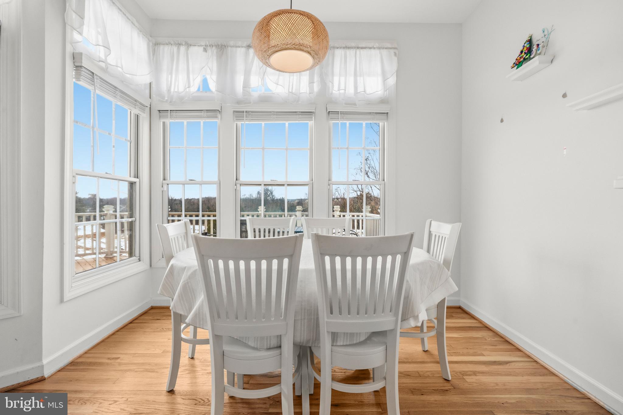 43003 Golf View Drive Chantilly, VA 20152 - Photo 17 of 54 a view of a dining room with furniture wooden floor and chandelier