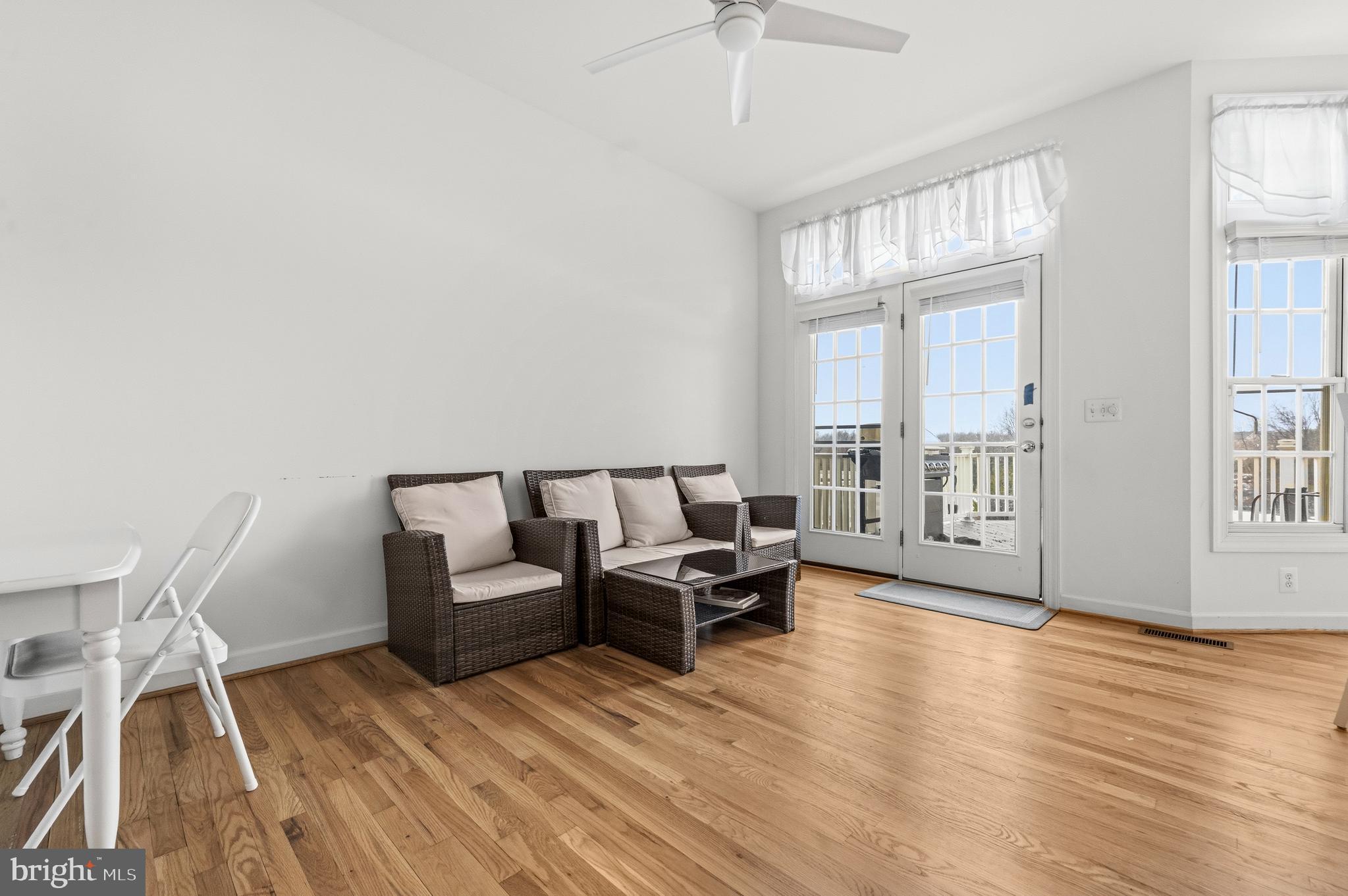43003 Golf View Drive Chantilly, VA 20152 - Photo 17 of 54 a living room with furniture a large window and wooden floor
