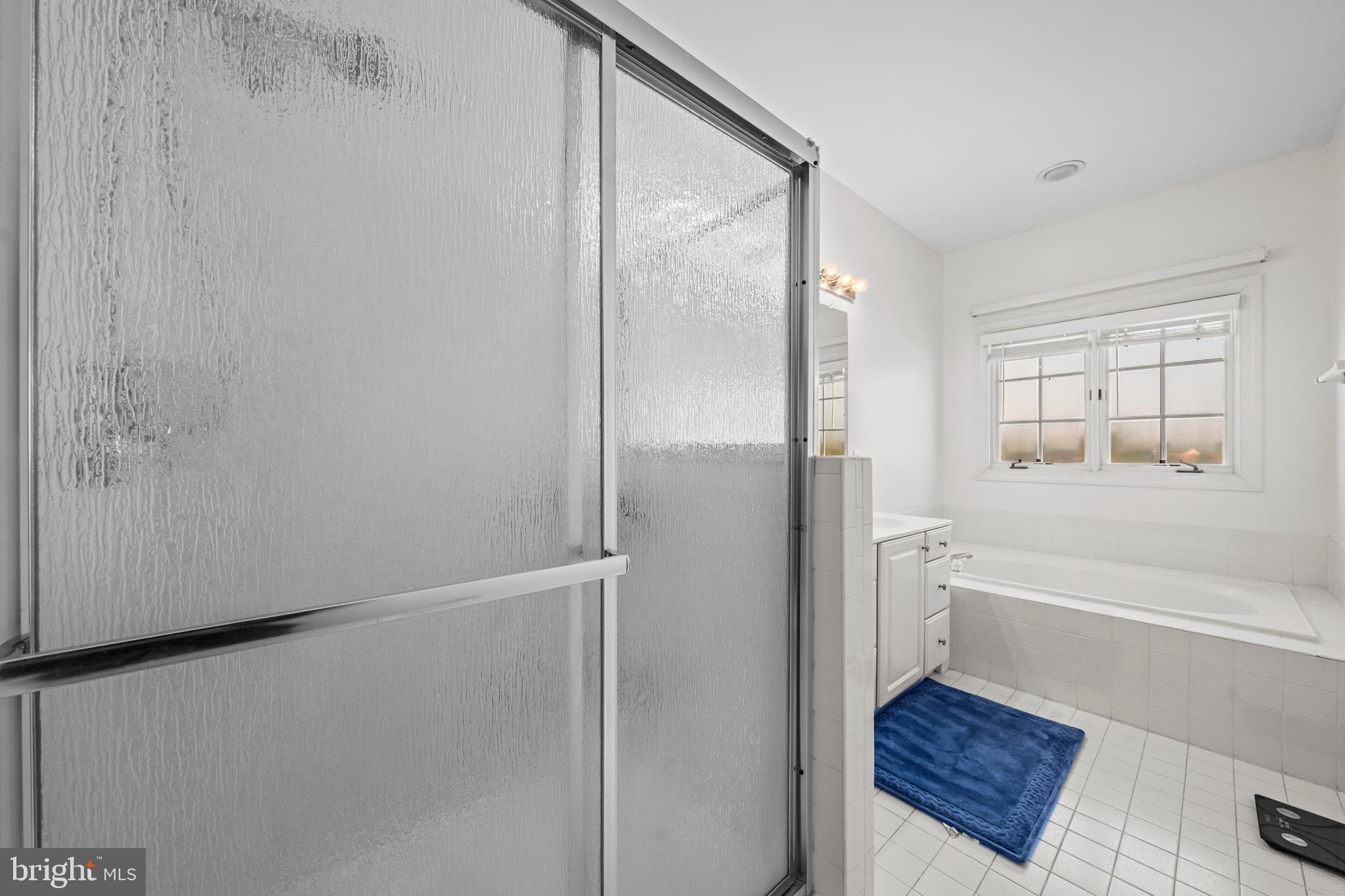 43003 Golf View Drive Chantilly, VA 20152 - Photo 27 of 54 a bathroom with a tub and a shower