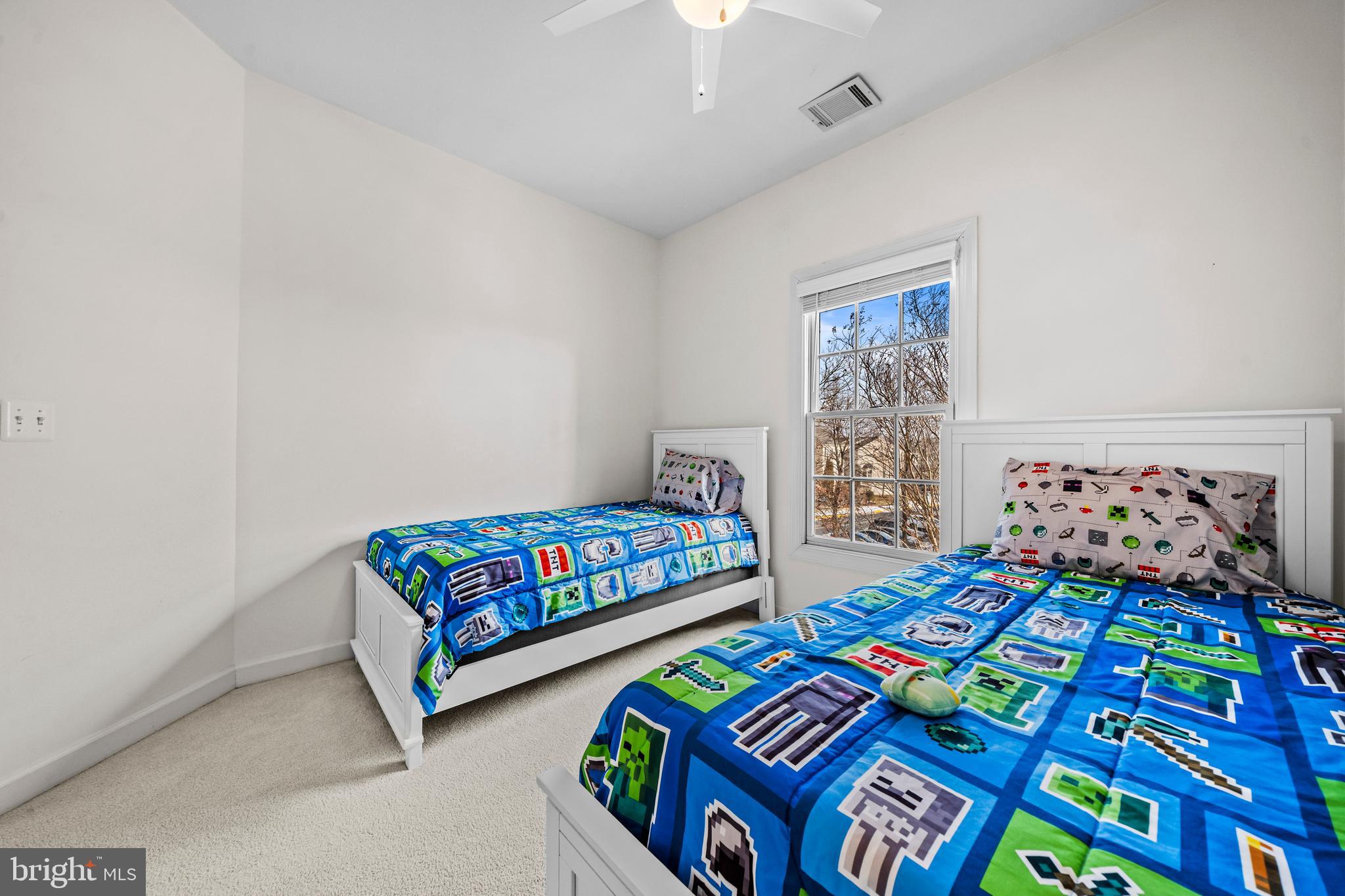 43003 Golf View Drive Chantilly, VA 20152 - Photo 31 of 54 a bedroom with two beds and a couch