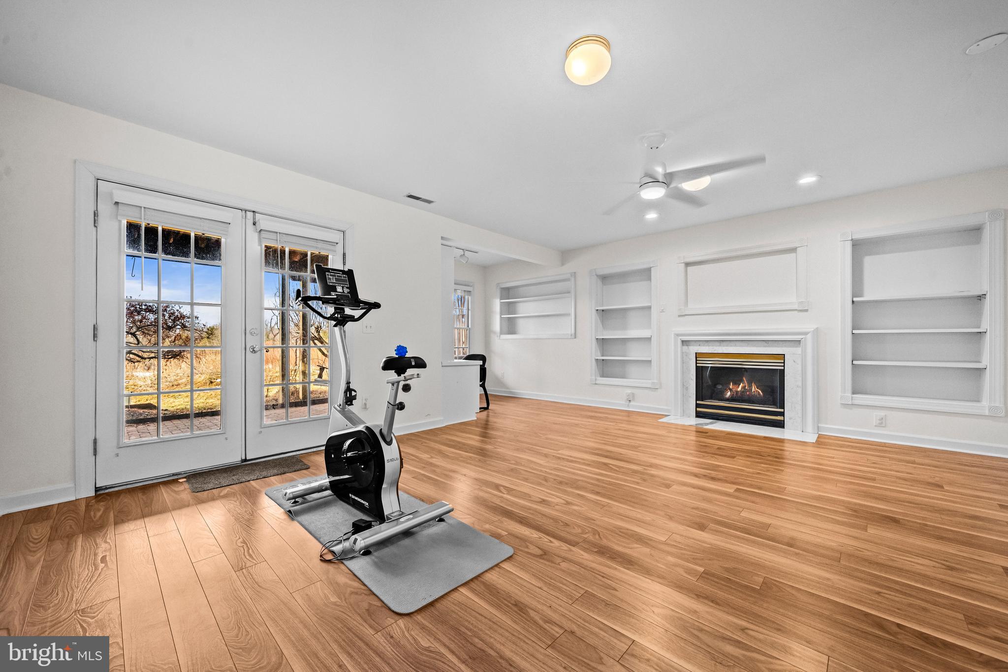 43003 Golf View Drive Chantilly, VA 20152 - Photo 35 of 54 a view of a livingroom with a fireplace and wooden floor