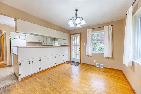 a view of a kitchen with marble kitchen and front door