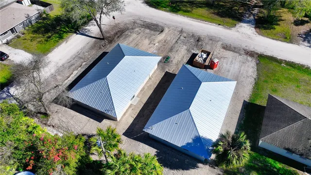 an aerial view of a house with outdoor space