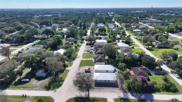 an aerial view of a house with a garden