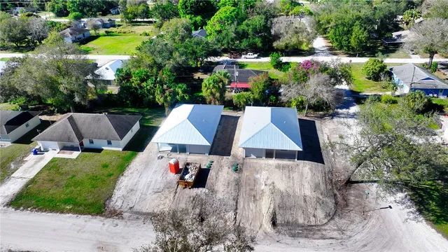 a view of swimming pool with outdoor seating and plants