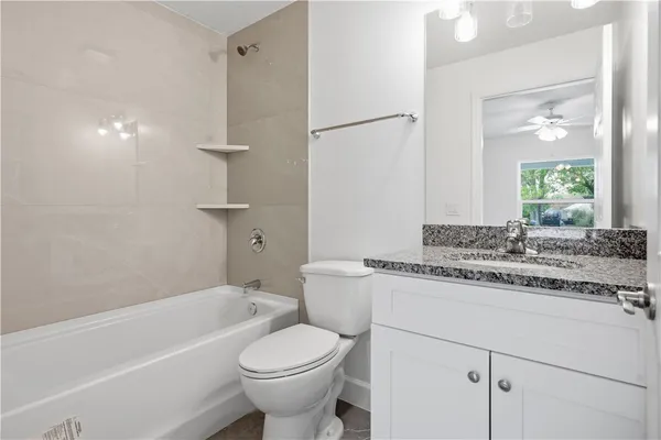 a bathroom with a sink a toilet and a bathtub