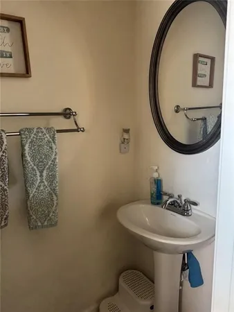 a bathroom with a sink and mirror