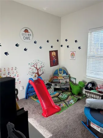 a living room with furniture and flat screen tv