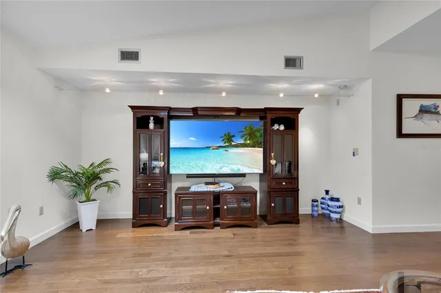 a kitchen with stainless steel appliances granite countertop a refrigerator a stove and a sink