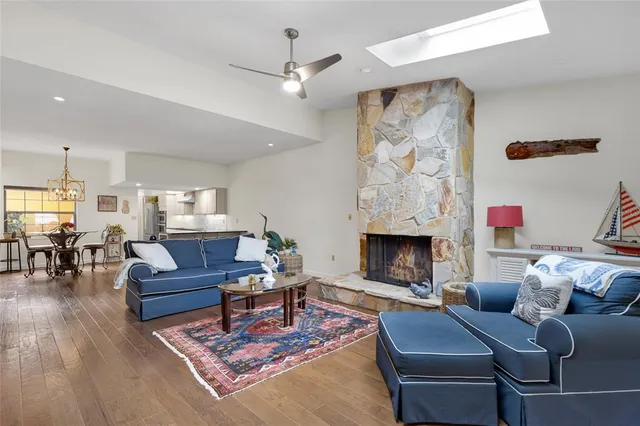 a kitchen with stainless steel appliances granite countertop a refrigerator and a stove