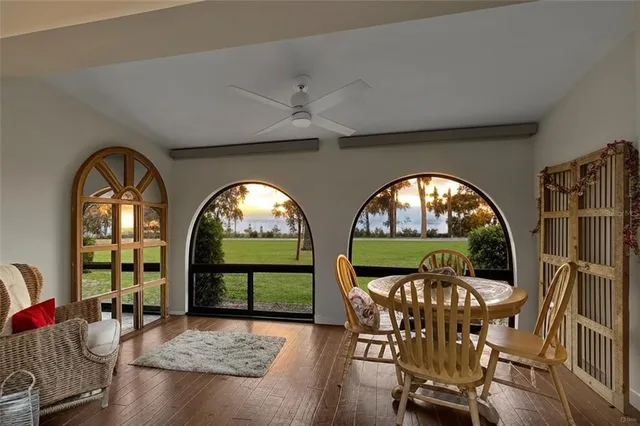 a kitchen with granite countertop a sink a stove and cabinets