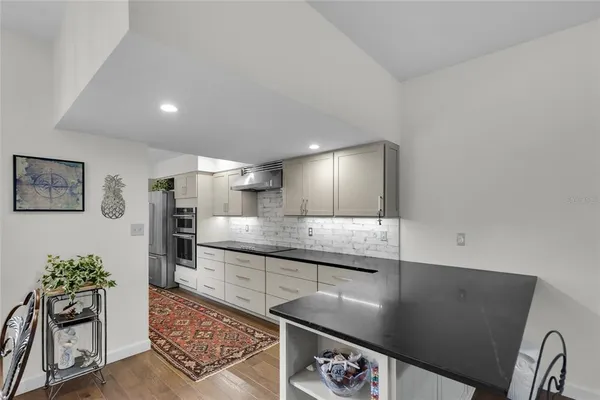 a kitchen with a sink and cabinets
