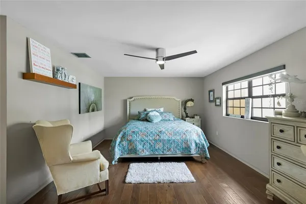 a bedroom with furniture and a window