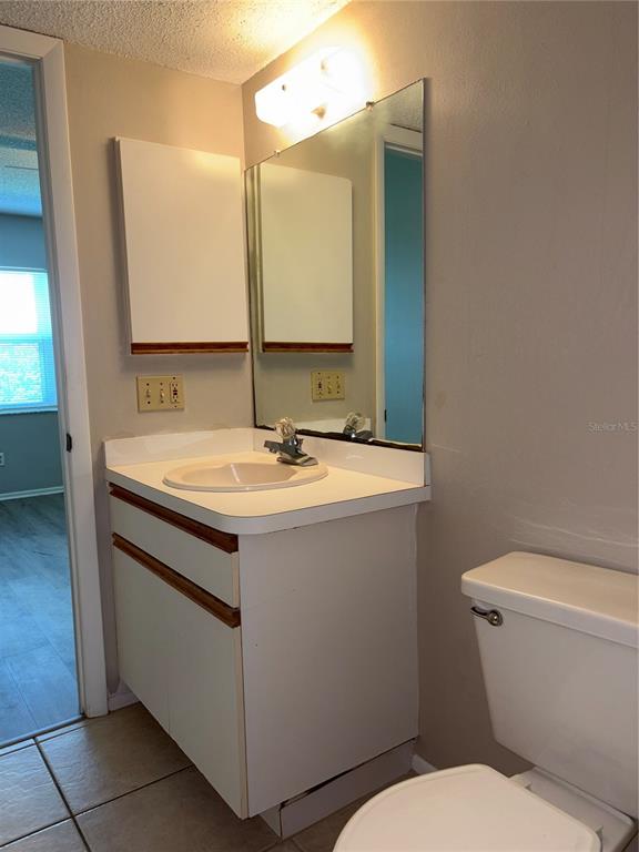 26485 Rampart Boulevard, Unit D1 Punta Gorda, FL 33983 - Photo 13 of 29 a bathroom with a sink and a mirror