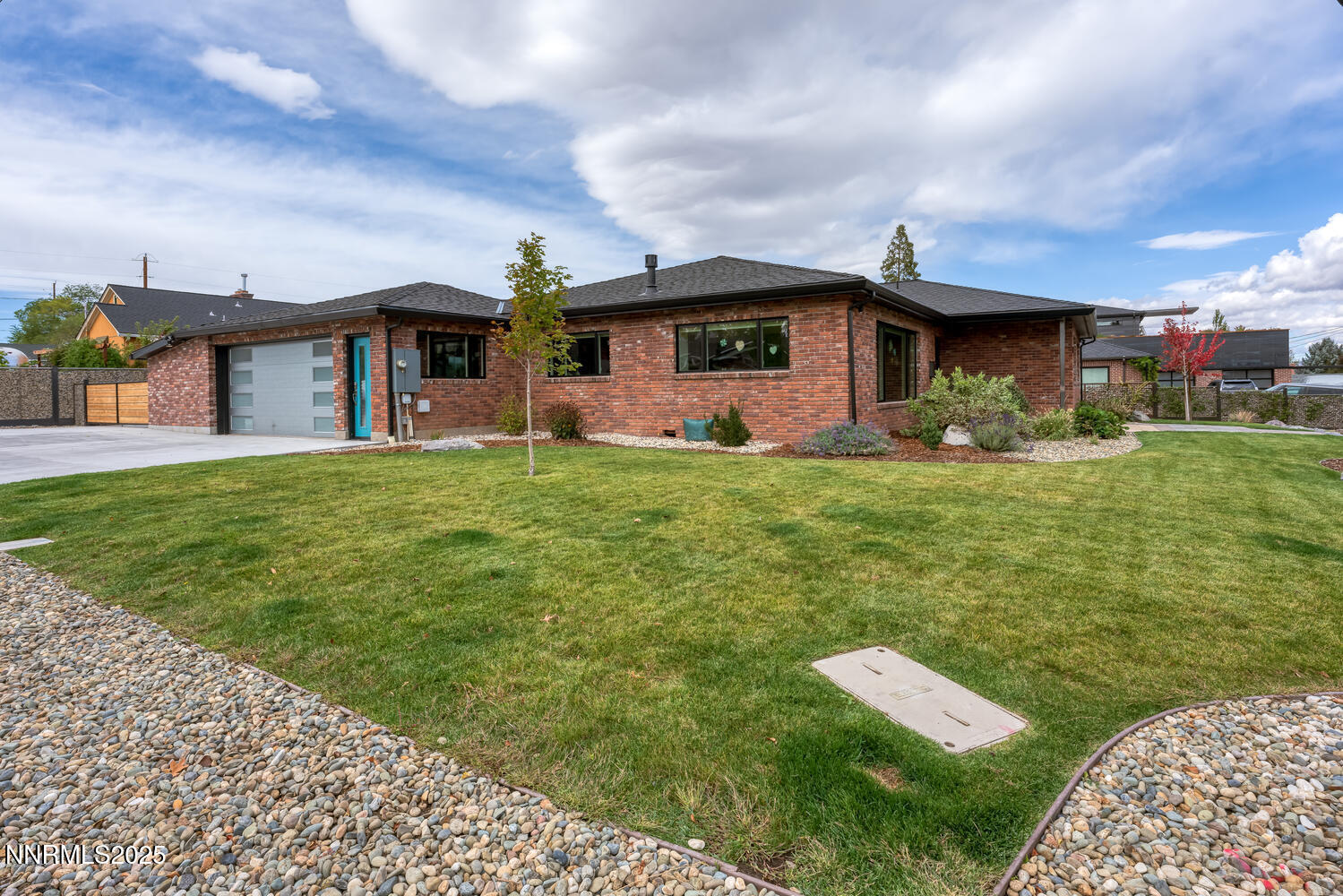 a front view of a house with a garden