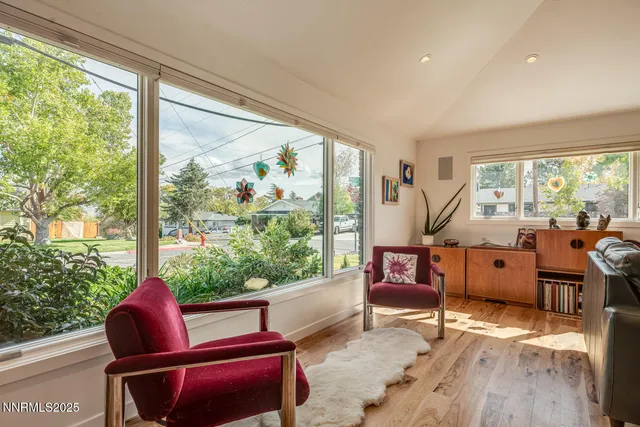 a bedroom with furniture and a window