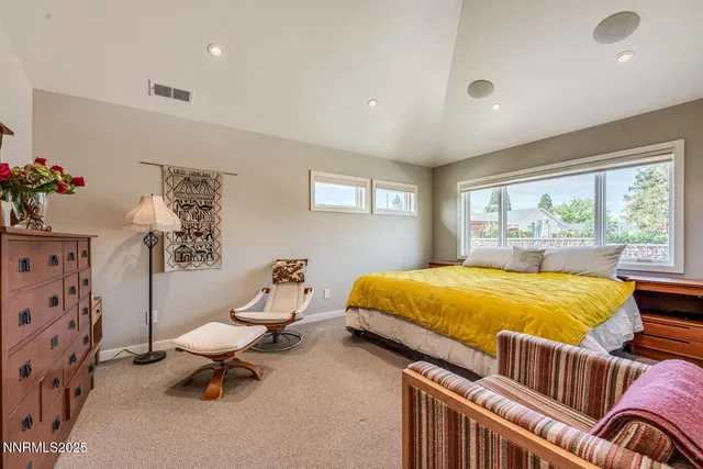 a bedroom with a bed and dresser