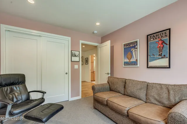 a bedroom with two beds and a large window