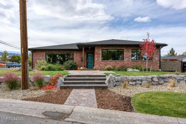 a front view of house with garden