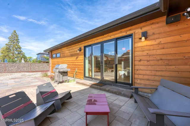 a balcony with furniture and a potted plant