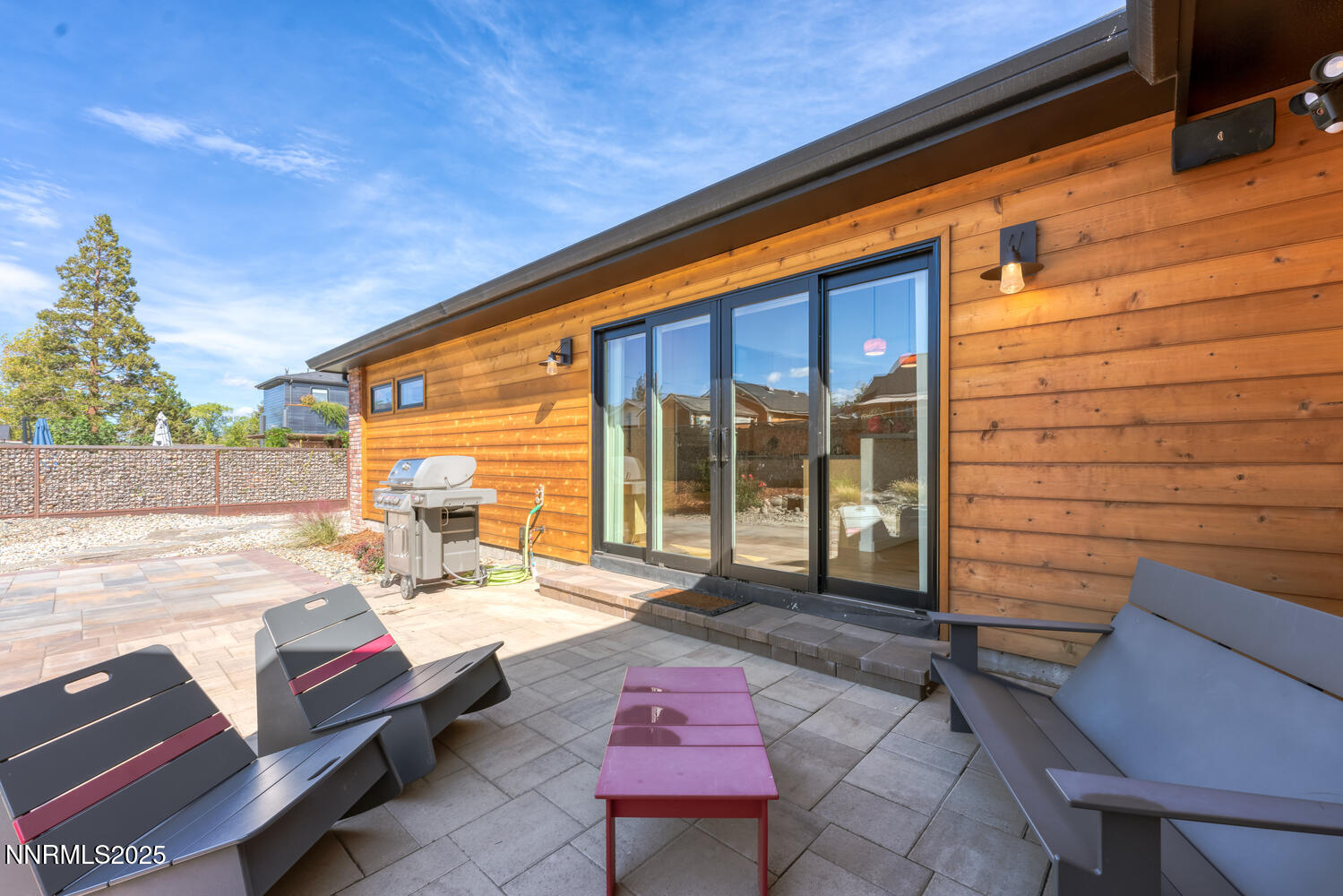 2395 Watt Street Reno, NV 89509 - Photo 41 of 50 a backyard of a house with barbeque oven table and chairs