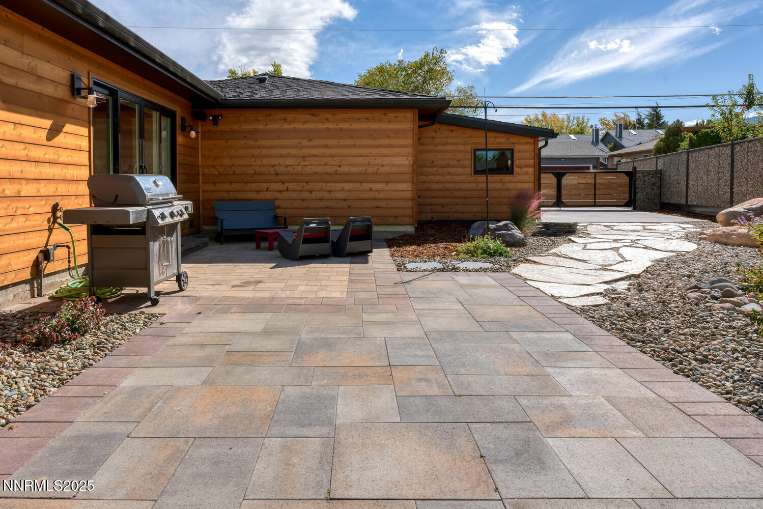 2395 Watt Street Reno, NV 89509 - Photo 43 of 50 a backyard of a house with barbeque oven and wooden fence