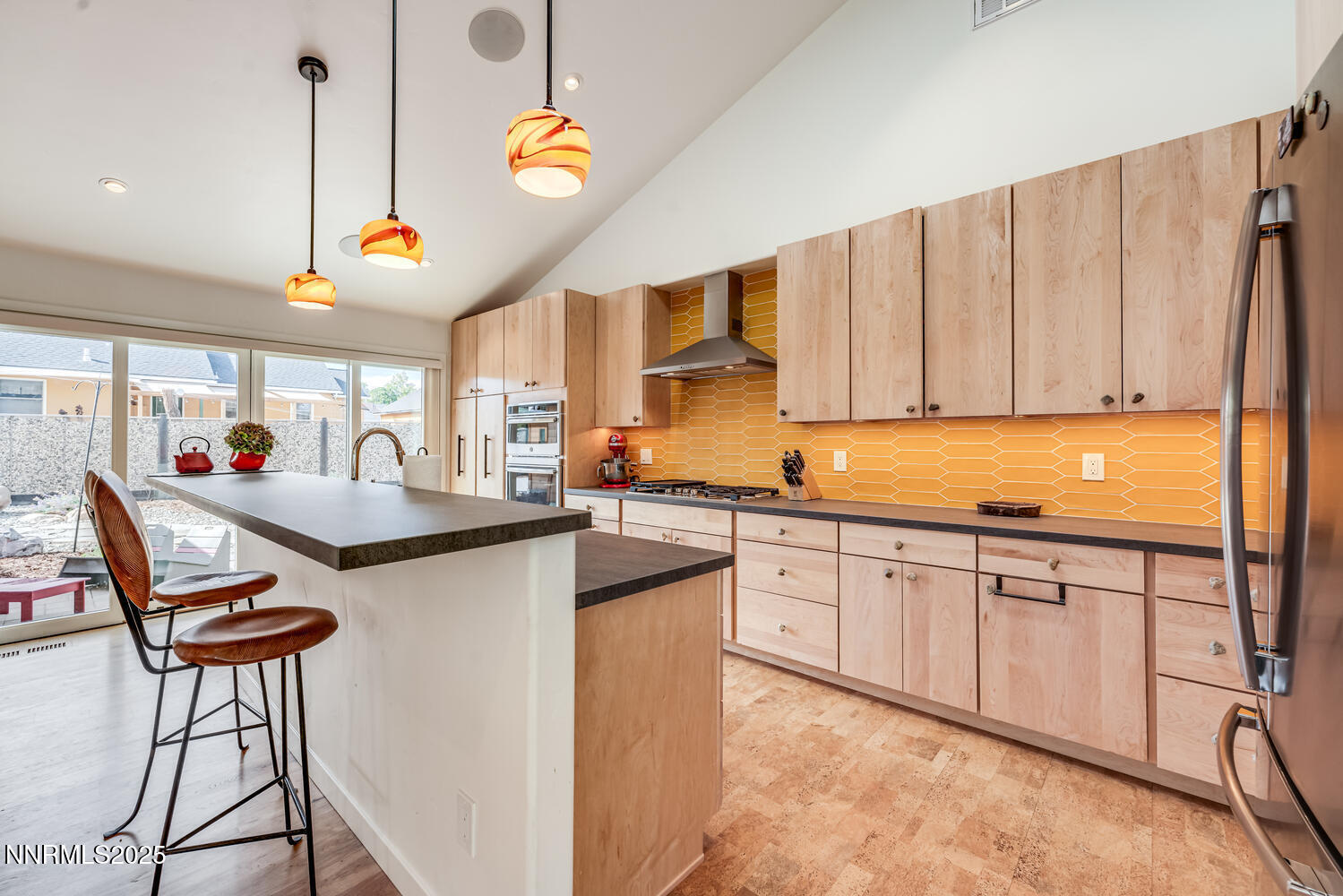 2395 Watt Street Reno, NV 89509 - Photo 7 of 50 a kitchen with stainless steel appliances granite countertop a sink a stove and a refrigerator