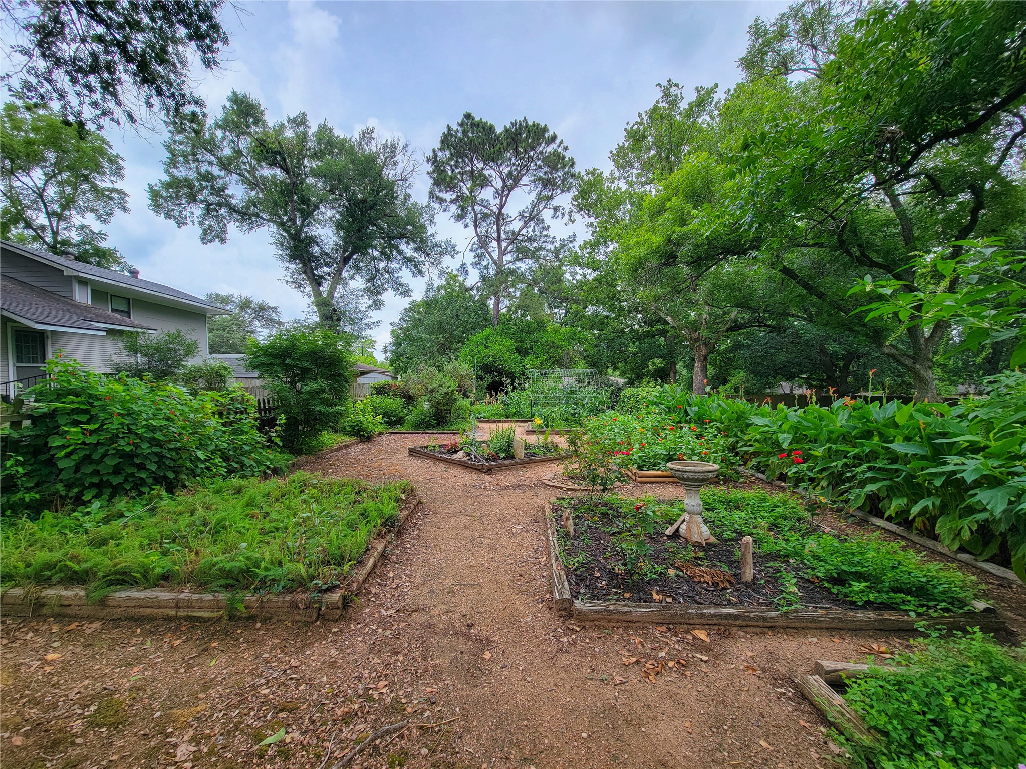 1406 Key Street Brenham, TX 77833 - Photo 35 of 50 Discover the joy of your own flourishing garden, perfect for growing fresh vegetables, herbs, and flowers.