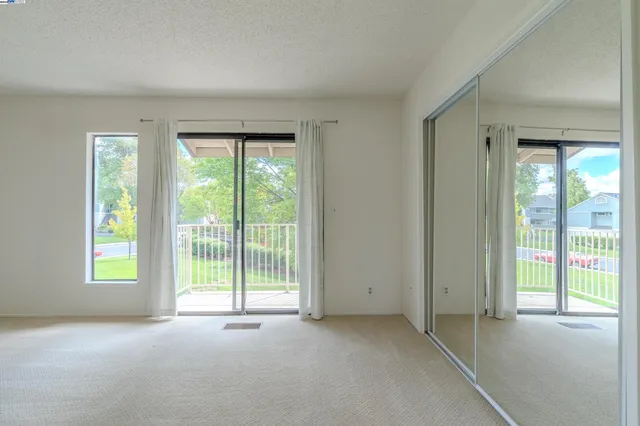 a view of a room with a large window