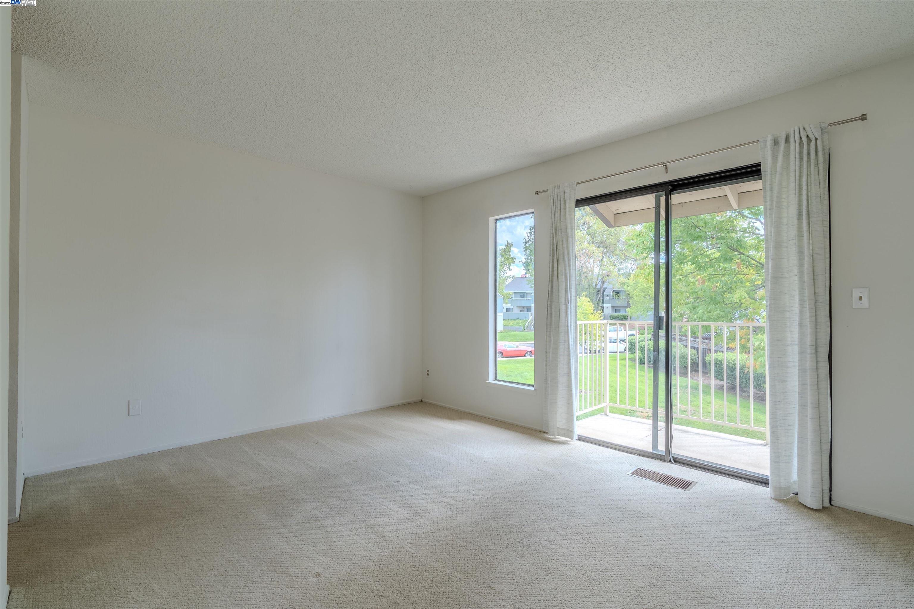 1785 Paseo Laguna Seco Livermore, CA 94551 - Photo 19 of 27 a view of empty room with floor to ceiling window