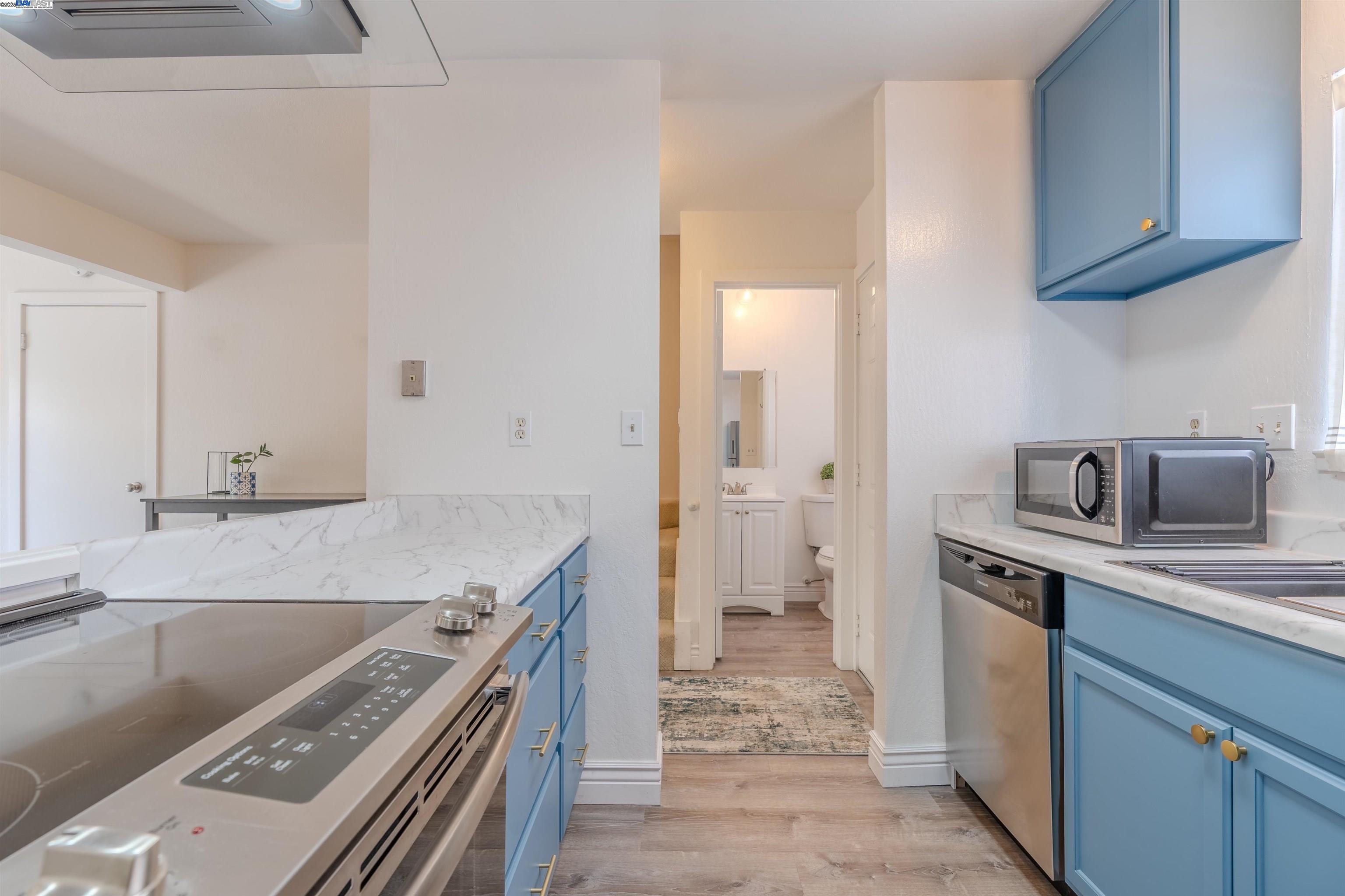 1785 Paseo Laguna Seco Livermore, CA 94551 - Photo 7 of 27 a kitchen with a stove sink and refrigerator