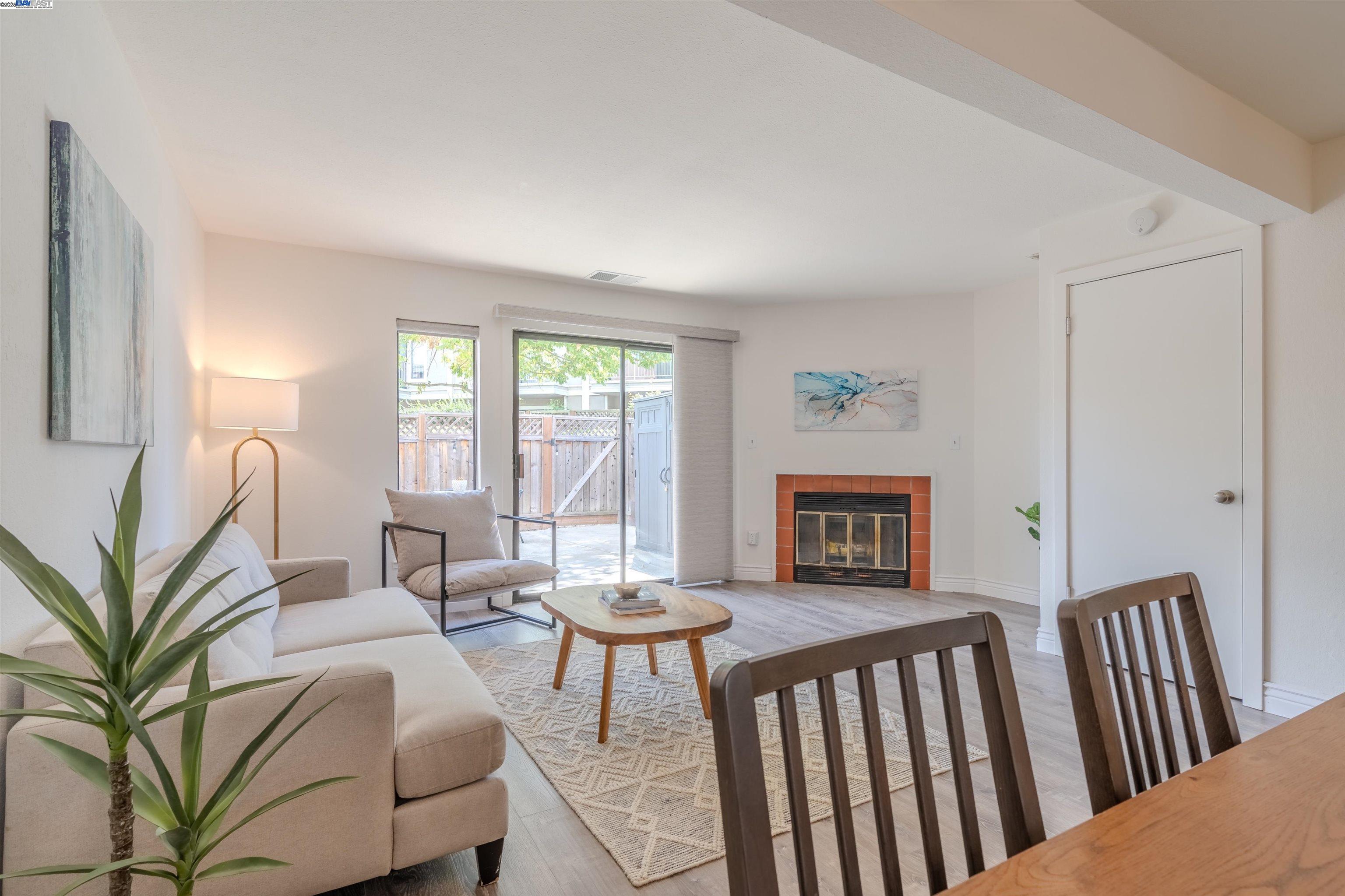 1785 Paseo Laguna Seco Livermore, CA 94551 - Photo 10 of 27 a living room with furniture a table and a large window
