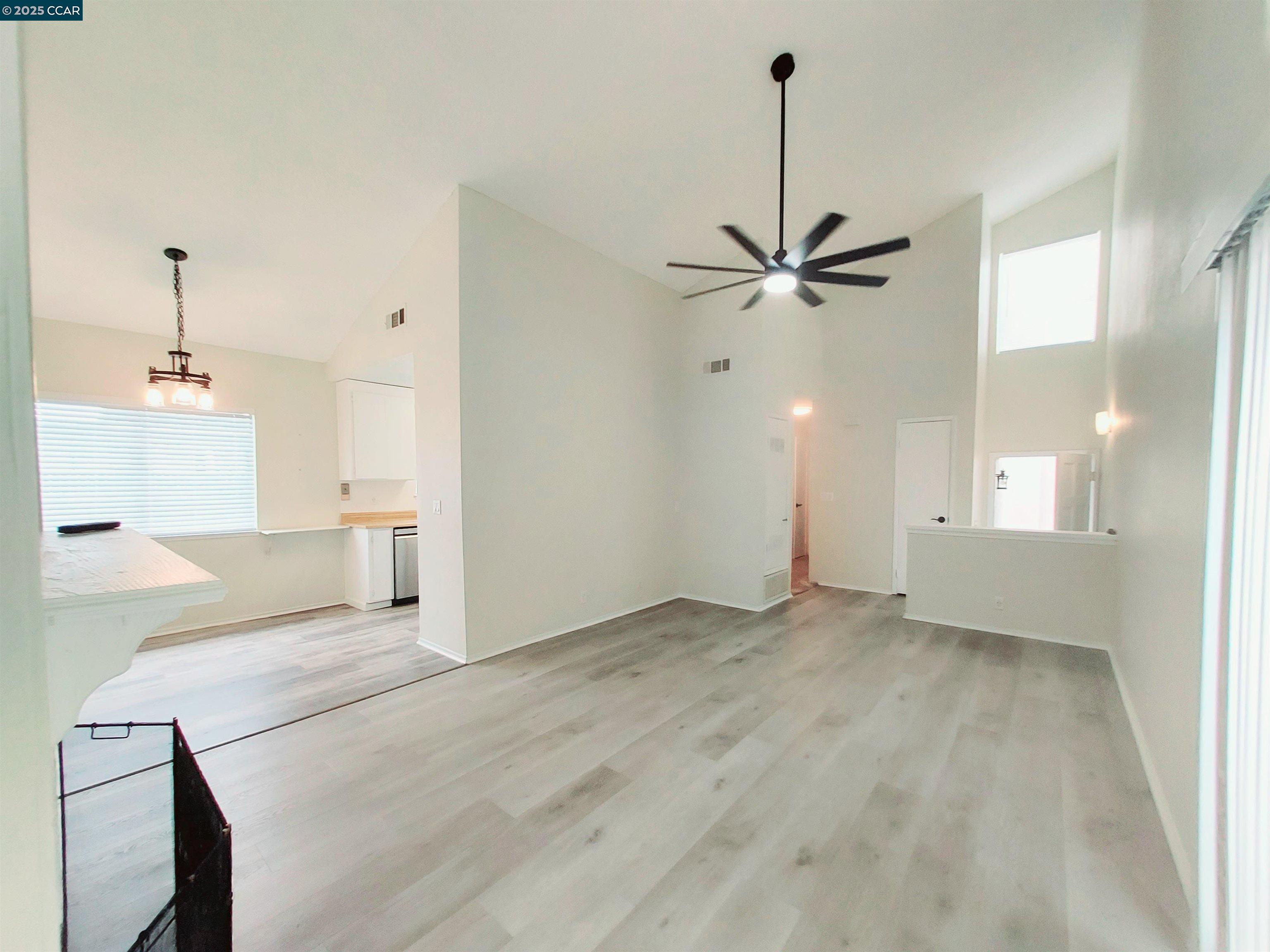 3712 Willow Pass Road, Unit 32 Concord, CA 94519 - Photo 4 of 20 a view of an empty room with a ceiling fan and window
