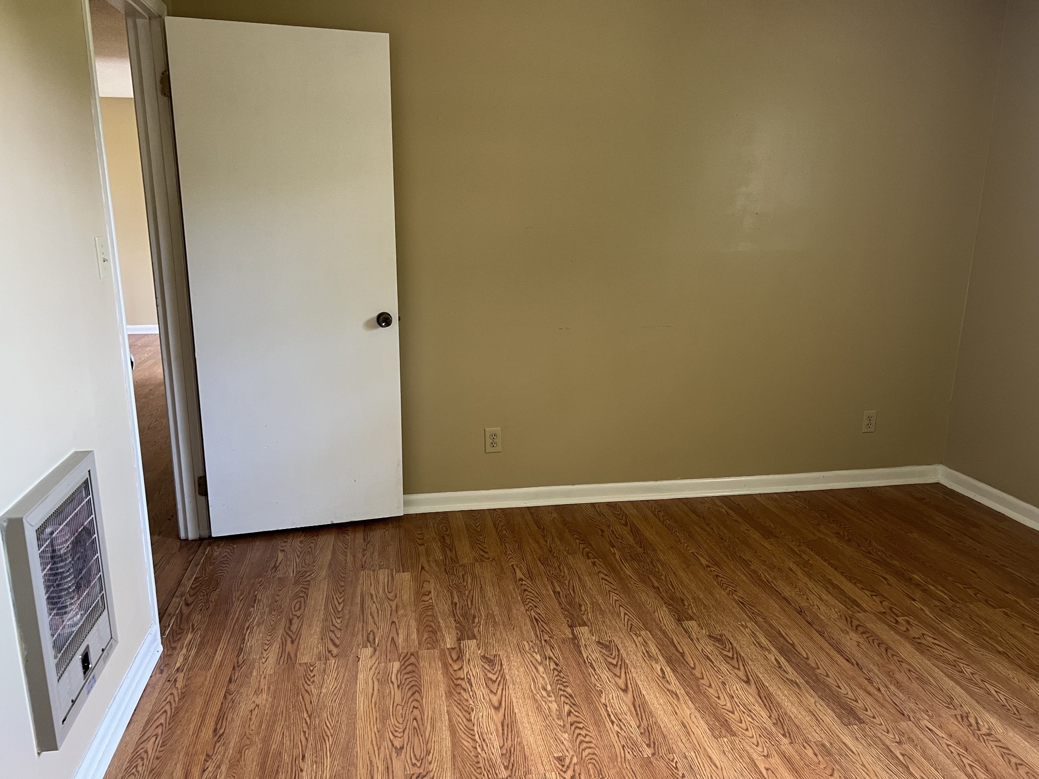 929 Industrial Access Road Pulaski, TN 38478 - Photo 14 of 28 a view of an empty room with wooden floor and a window