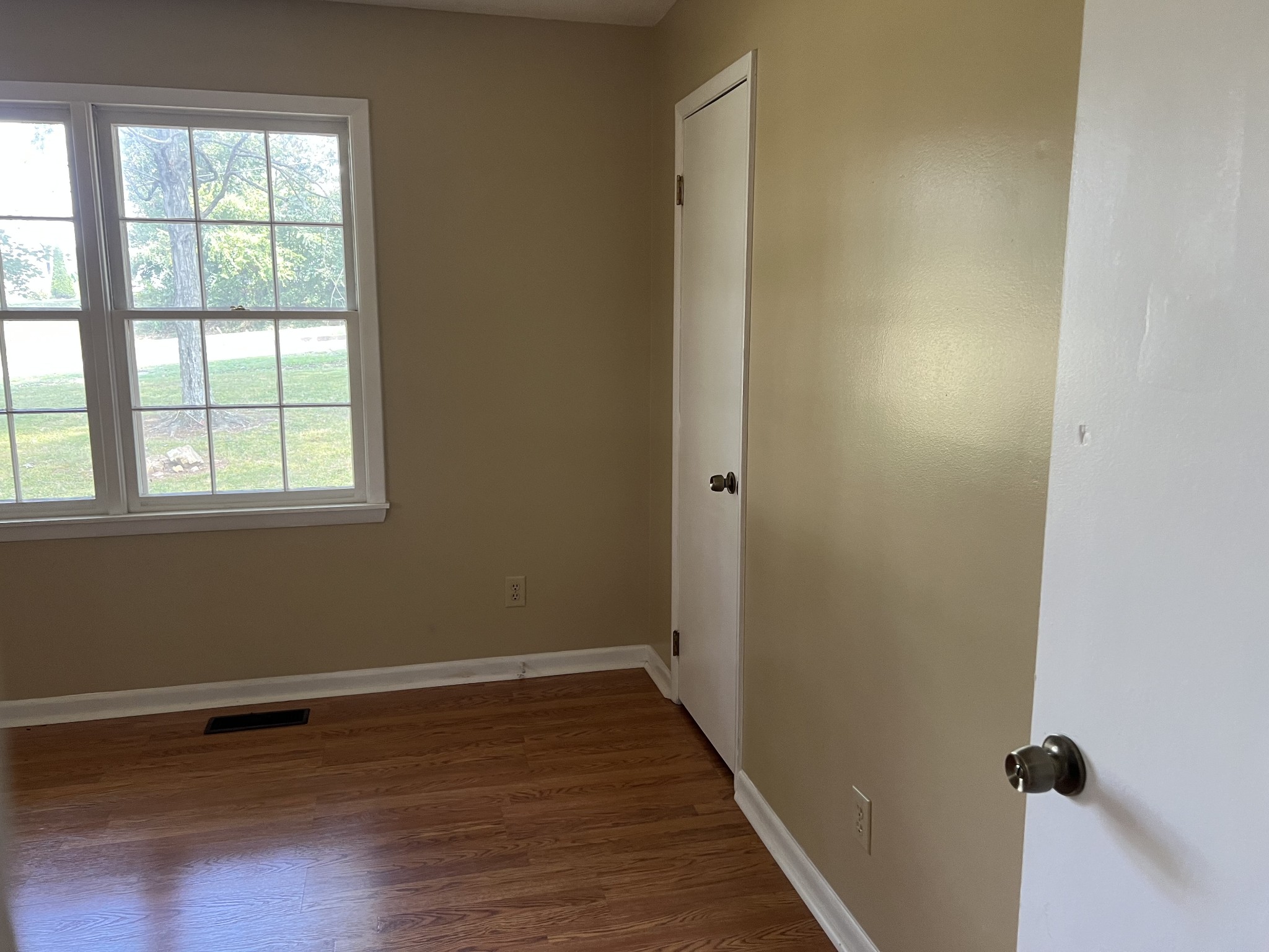 929 Industrial Access Road Pulaski, TN 38478 - Photo 21 of 28 wooden floor in an empty room with a window