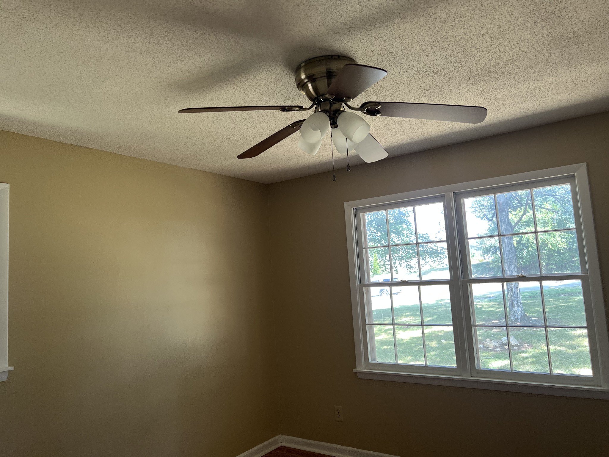 929 Industrial Access Road Pulaski, TN 38478 - Photo 22 of 28 an empty room with a window and a fan