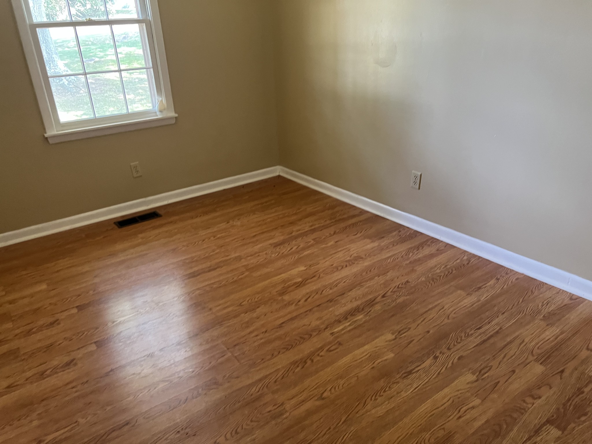 929 Industrial Access Road Pulaski, TN 38478 - Photo 24 of 28 an empty room with wooden floor and windows