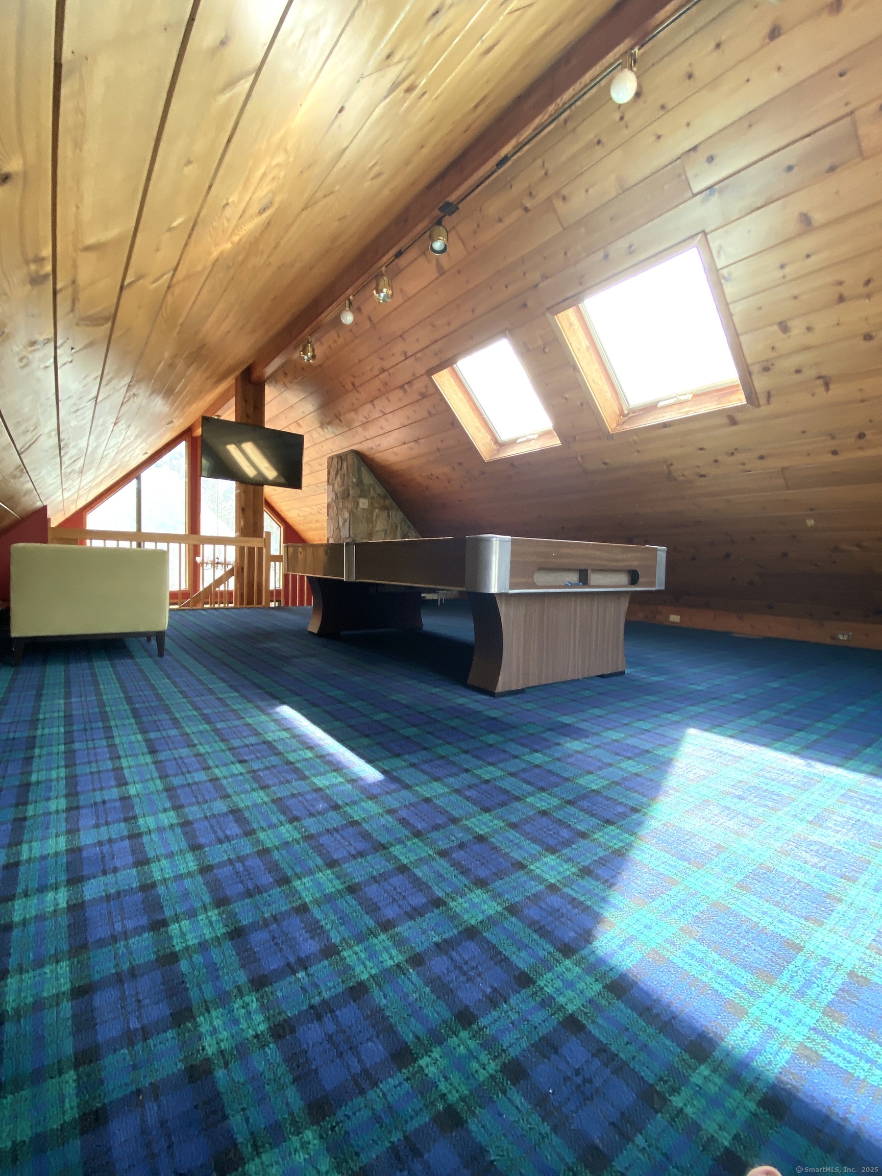 21 Holiday Point Road Sherman, CT 06784 - Photo 12 of 25 a room with hard wood floors and a wooden bench