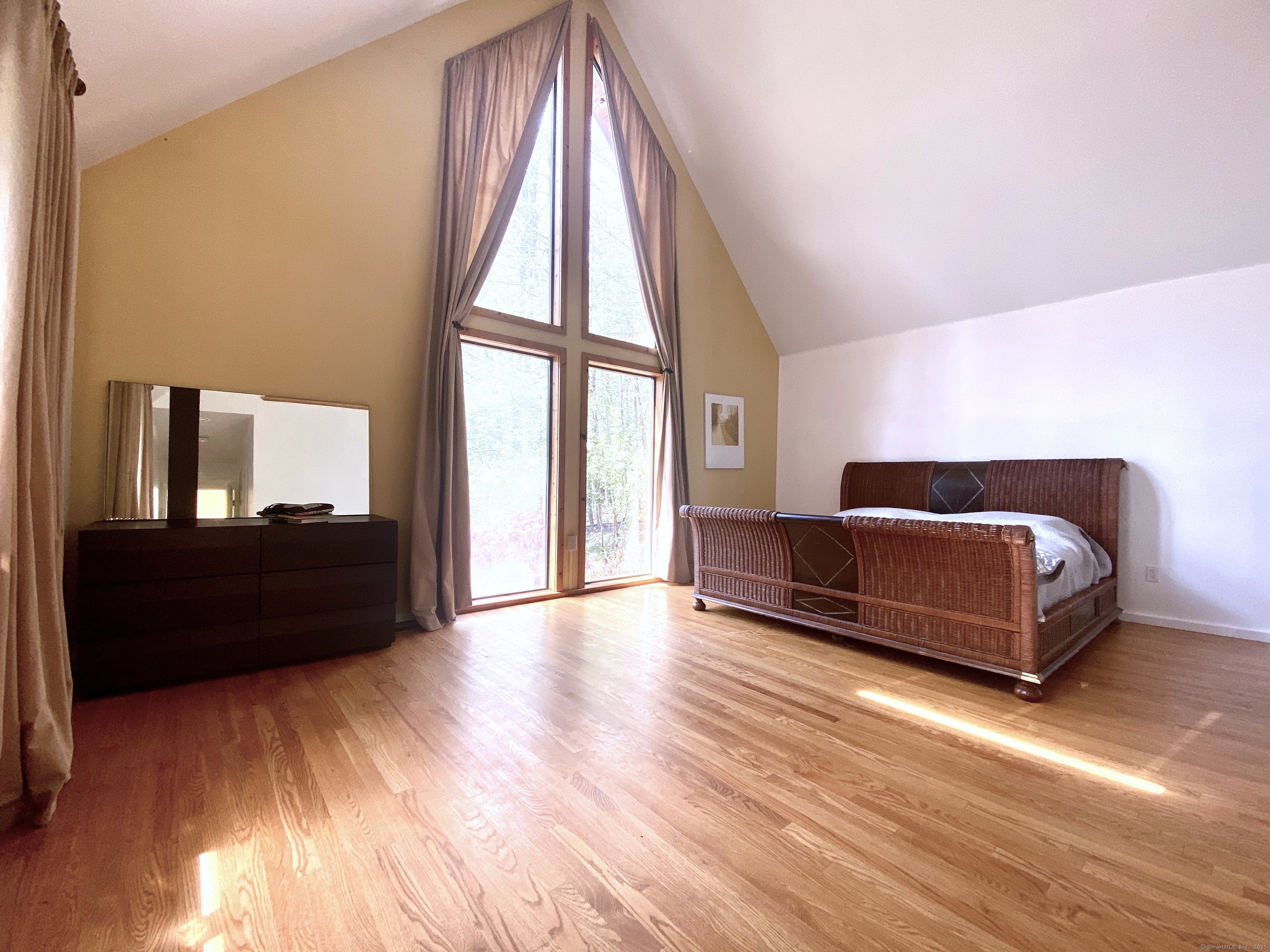 21 Holiday Point Road Sherman, CT 06784 - Photo 13 of 25 a living room with a bed furniture and a large window