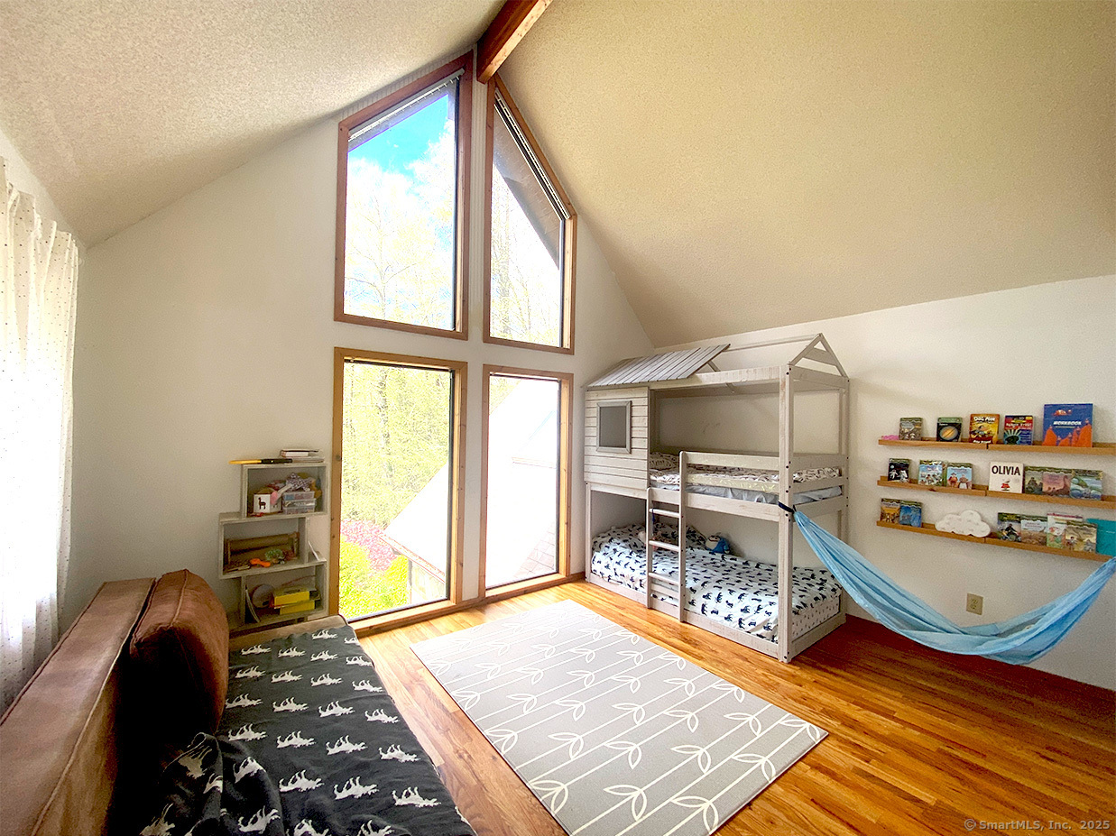21 Holiday Point Road Sherman, CT 06784 - Photo 14 of 25 a bedroom with furniture and a window