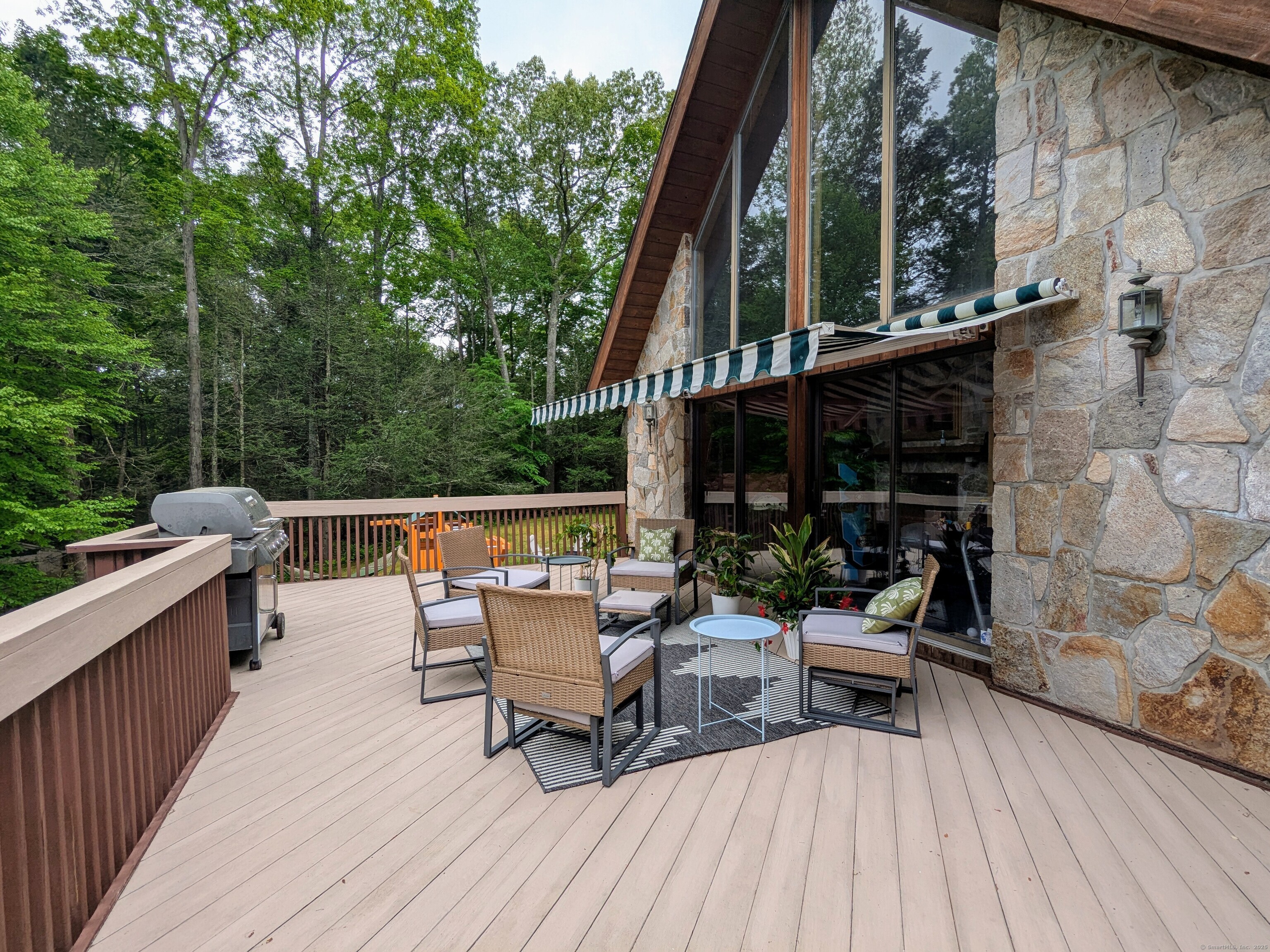 21 Holiday Point Road Sherman, CT 06784 - Photo 19 of 25 a balcony with wooden floor and outdoor seating