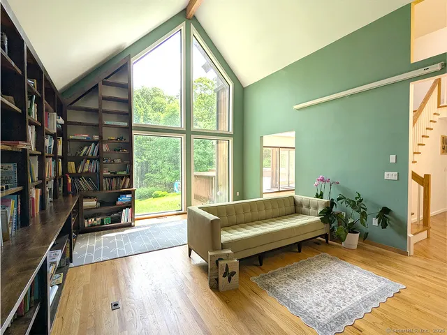 a living room with furniture and a rug