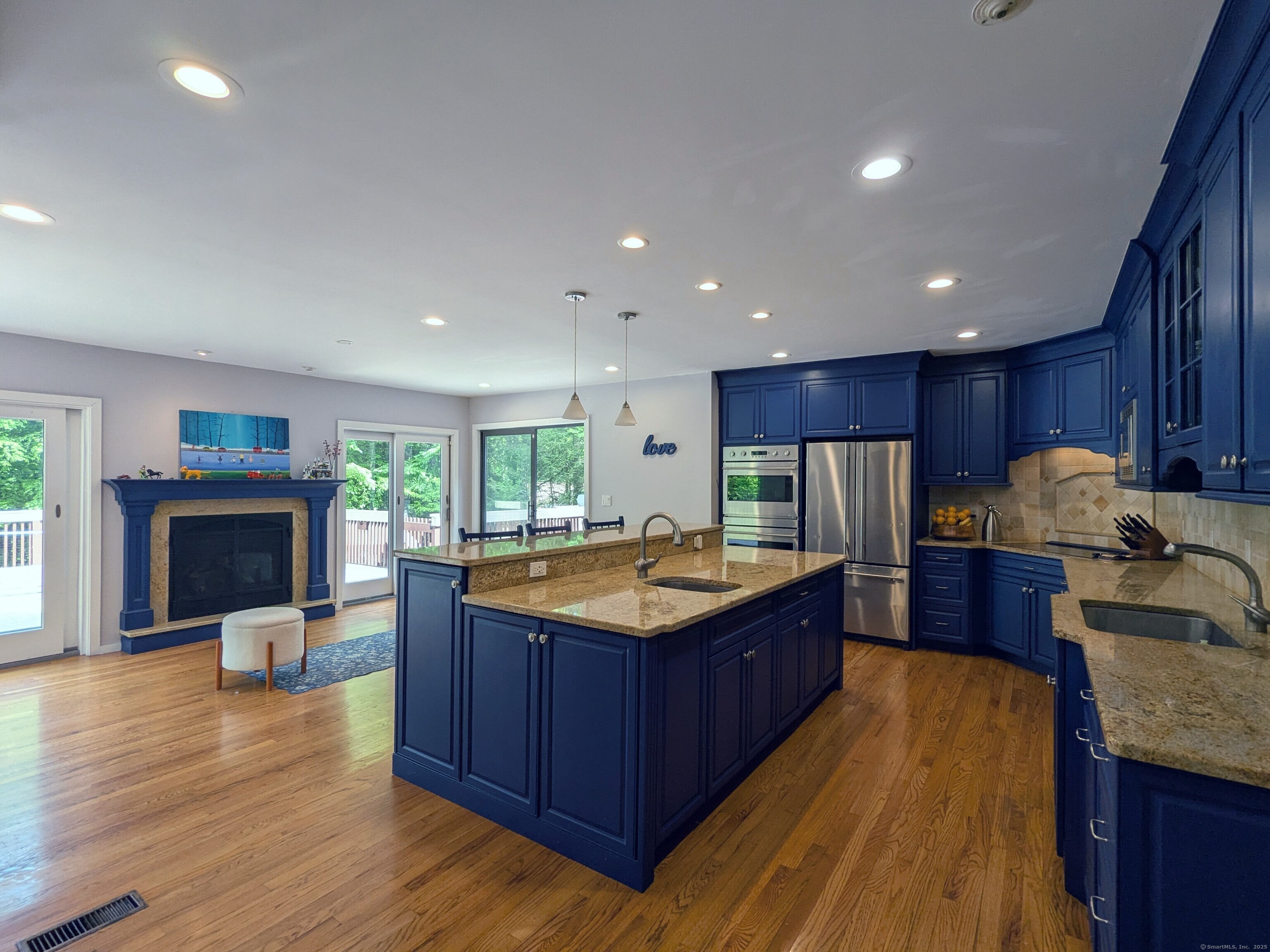 21 Holiday Point Road Sherman, CT 06784 - Photo 6 of 25 a kitchen with kitchen island granite countertop a sink stove and refrigerator